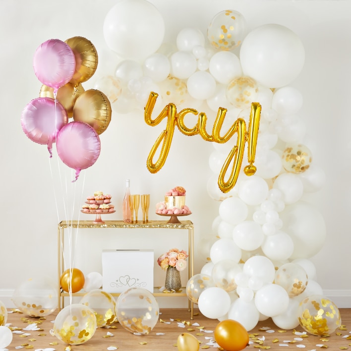 White, gold, and pink celebration balloons