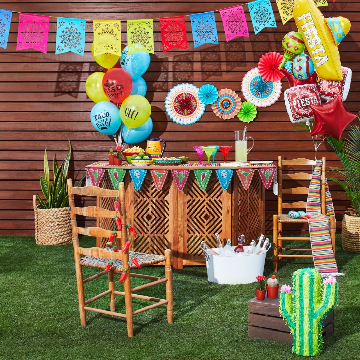 Outdoor party decorations with table and chairs