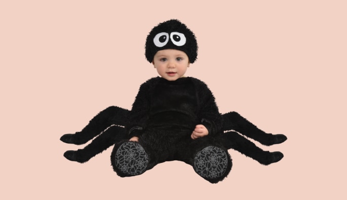 Baby wearing a spider costume.