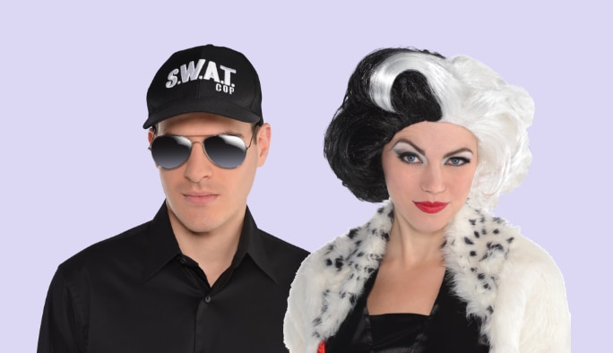 A man wearing a swat team hat and glasses and a woman wearing a black & white wig. 