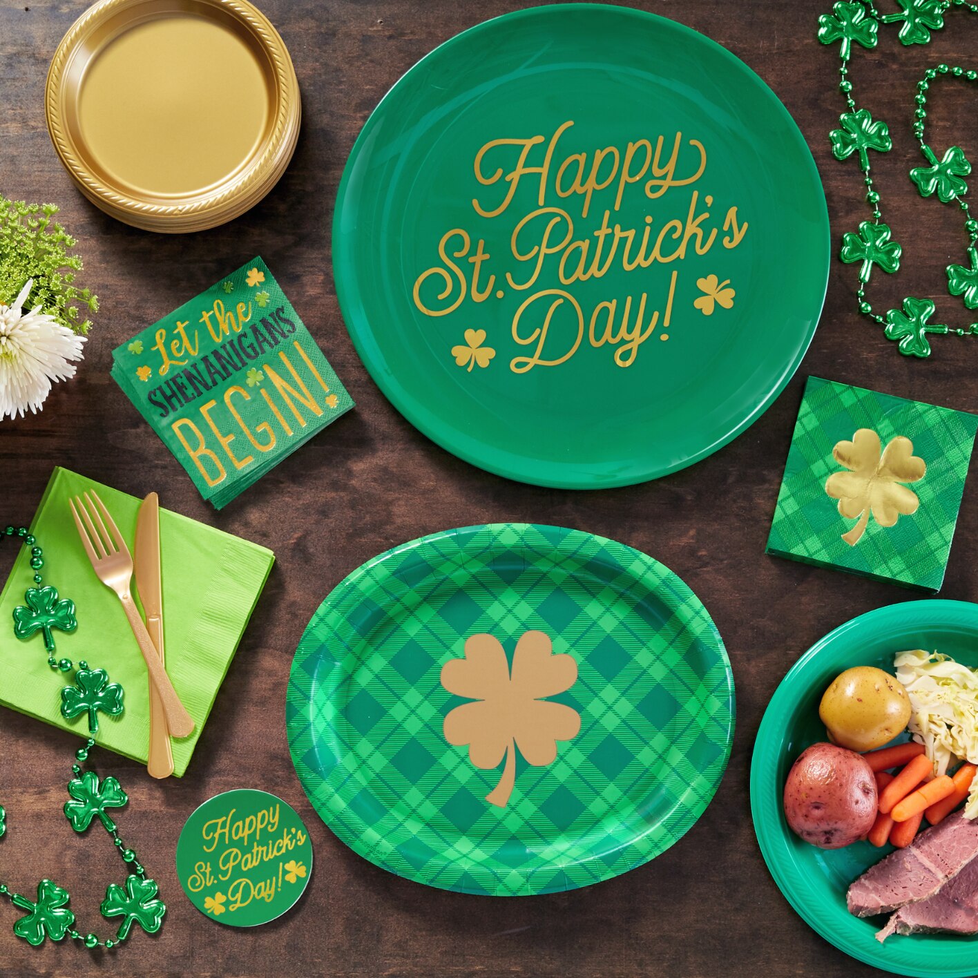 Tabletop with green St. Patrick’s Day-themed plates, napkins, and bead decorations. 
