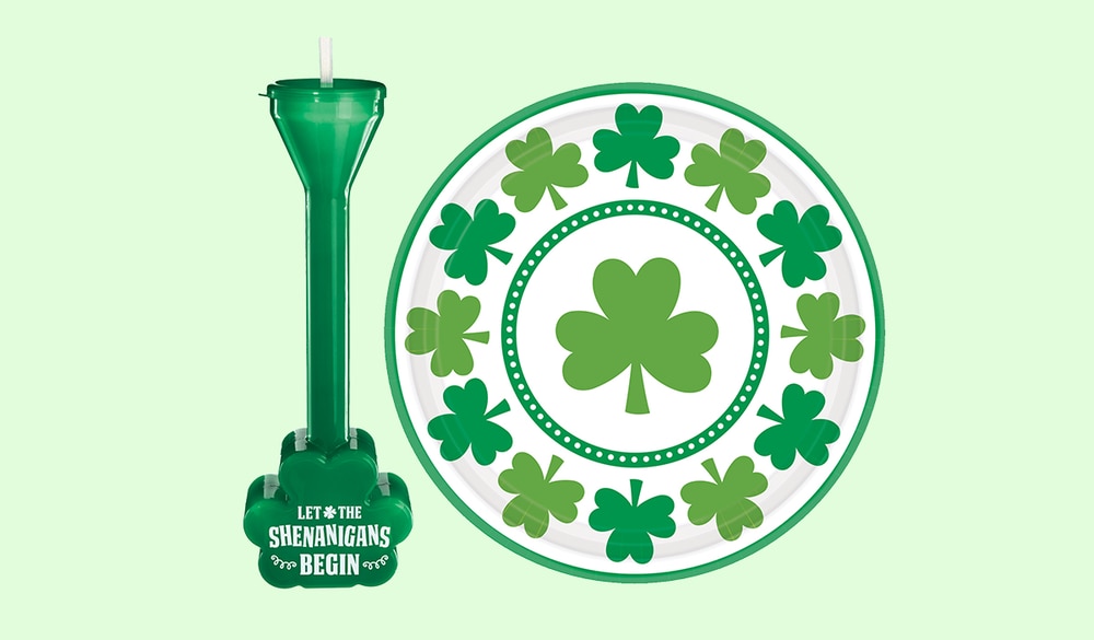 A green St. Patrick's Day shamrock shaped half-yard drinking glass and a St. Patrick's Day lucky shamrock lunch plate.