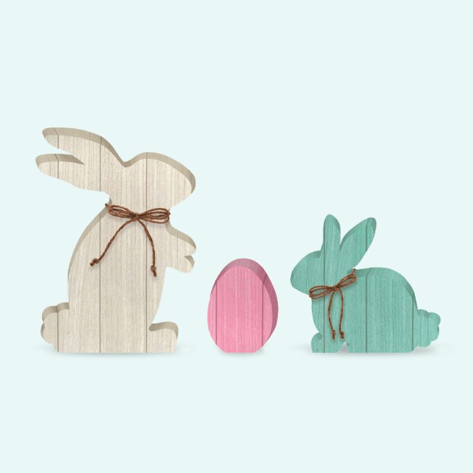A 3-piece set of Easter MDF standing decorations shaped like bunnies and an egg. 