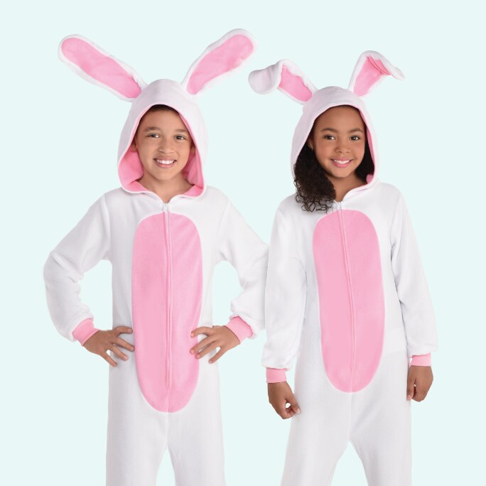 Two children wearing white and pink child bunny zipster costumes.