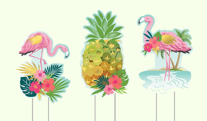 A 3-piece set of flamingo and pineapple summer lawn stake decorations.