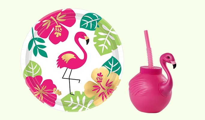 A pink, gold and green You Had Me at Aloha dessert plate and a pink flamingo cup with straw.