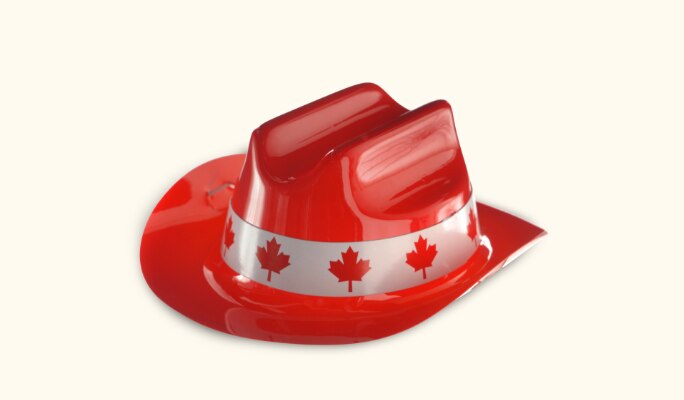 A red and white plastic mini Canadian maple leaf cowboy hat. 