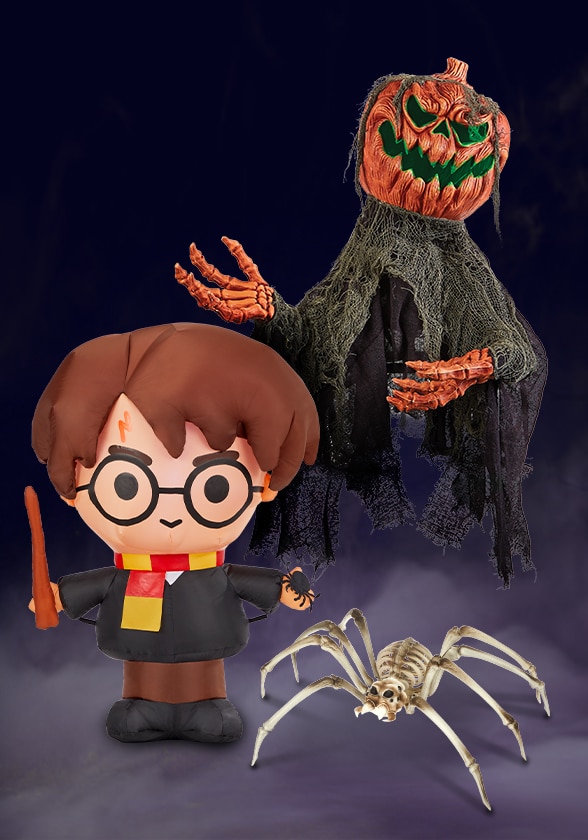 An animated Pumpkin Man, an inflatable Harry potter decoration and a giant skeleton spider decoration.