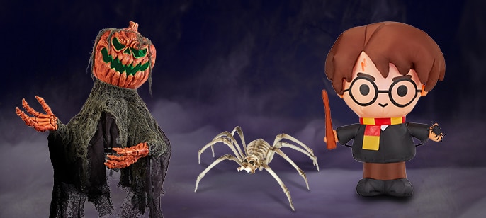 An animated Pumpkin Man, an inflatable Harry potter decoration and a giant skeleton spider decoration.