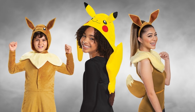 Three kids wearing assorted Pokémon character costumes.