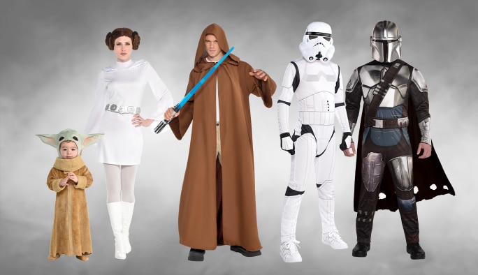 A toddler and four adults wearing assorted Star Wars character costumes.