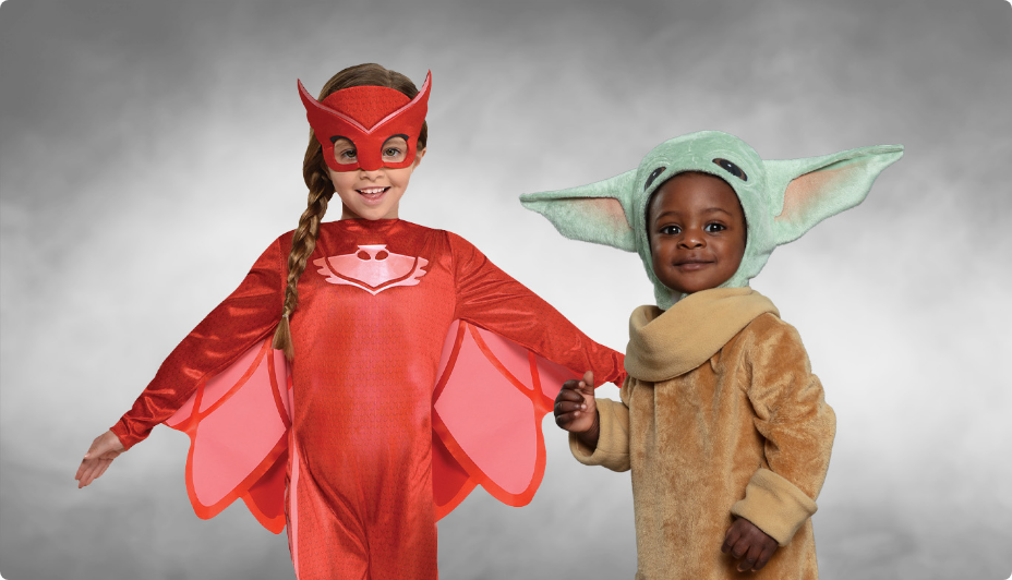 A girl in a red PJ Masks Owlette costume and a boy in a Baby Yoda costume.