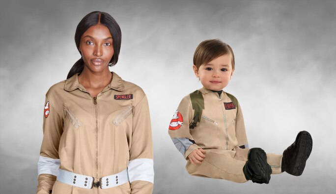 A woman and a toddler wearing Ghostbusters costumes. 