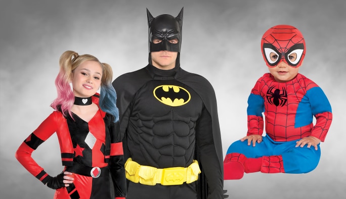 A girl in a Harley Quinn costume, a man in Batman costume and a baby in a Spider-man costume.