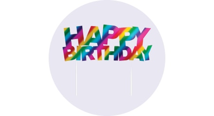 A multi-coloured birthday cake topper. 