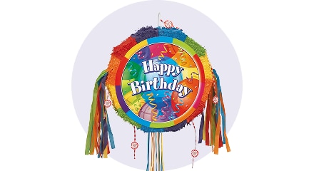 A multi-coloured pinata with the words 'Happy Birthday' written on it. 
