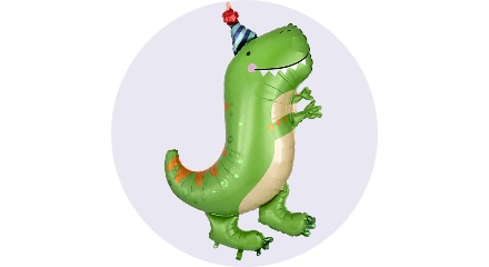 Un ballon en forme d'un dinosaure vert portant un chapeau de fête.