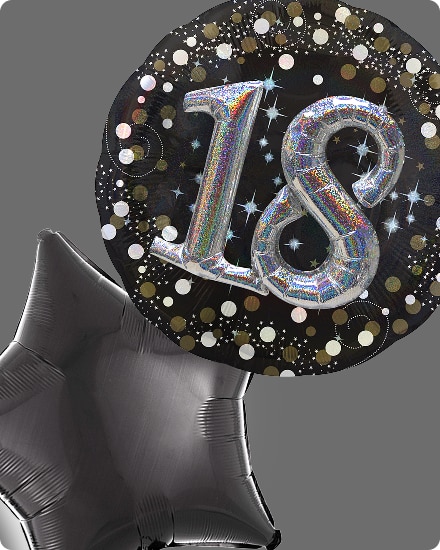 Un ballon noir avec des confettis blancs et dorés et le chiffre « 18 » imprimé sur le devant en argent, à côté d’un ballon en forme d’étoile.