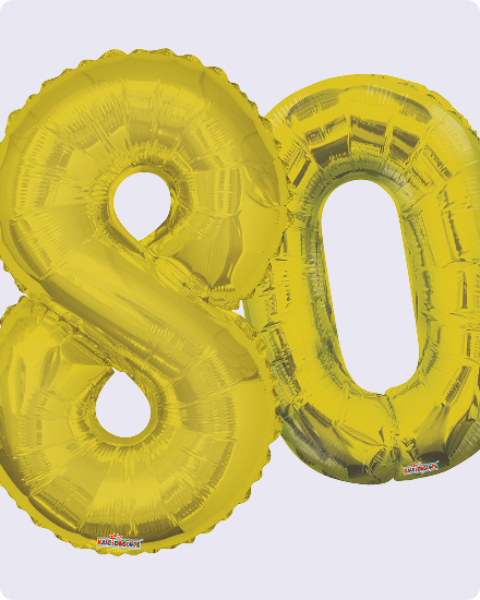 Des ballons dorés en forme du chiffre 80.