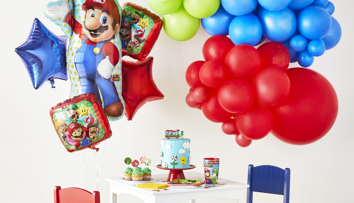 A room decorated with a PAW Patrol balloon bouquet and assorted PAW Patrol party supplies.