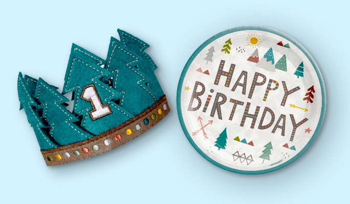 A Wilderness Birthday paper plate and a Wilderness 1-inch green fabric crown.