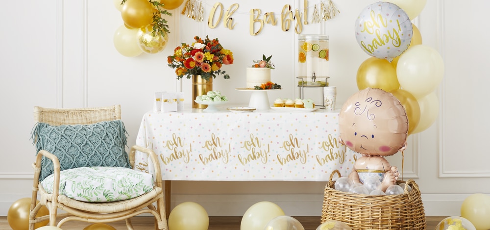 White and gold baby shower decorations.