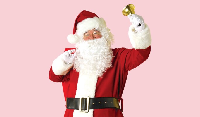 A man dressed in a red santa suit.