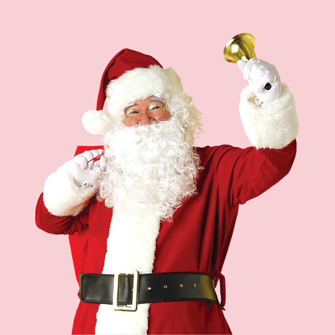 A man dressed in a red santa suit.