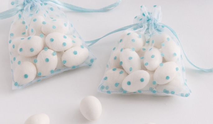 White tulle circles in a blue polka dot mesh bag.