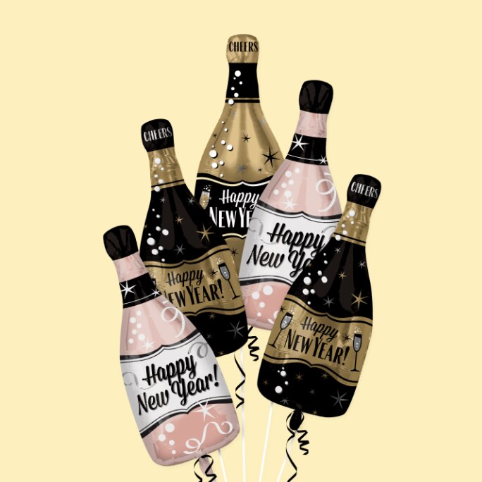 A bouquet of black and pink champagne bottle-shaped balloons with "Happy New Year!" written on them.