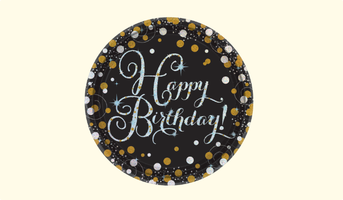 A black paper plate featuring a "Happy Birthday!" message and a border of gold and silver bubbles.