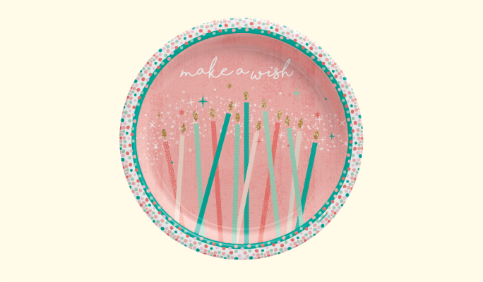 A round paper plate feautring a "Make a Wish" message and birthday candles on a pink background with a confetti border.