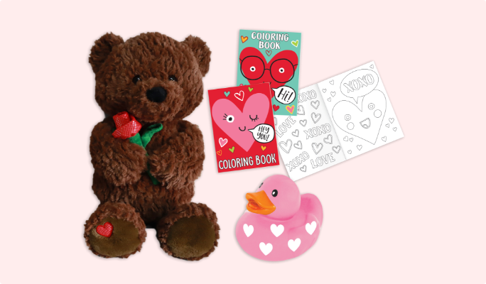 A plush brown bear, a pink and white rubber duck and two Heart Face colouring books.