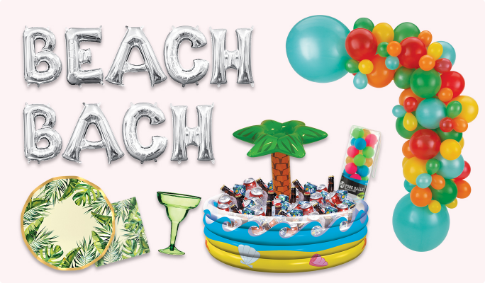 Silver letter balloons that read BEACH BACH, a orange, red and green balloon garland, an inflatable palm tree oasis cooler, a green magarita glass and a plate and napkin featuring a palm leaf pattern.