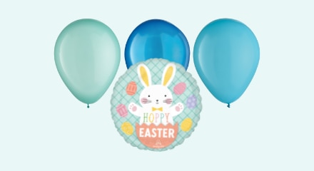 A "Hoppy Easter" balloon featuring a white bunny and Easter eggs, and three latex balloons in various shades of blue.