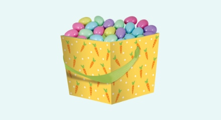 Pastel fillable Easter eggs in a yellow carrot-patterned bucket.