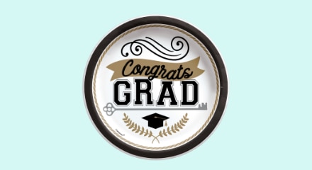 A round white and gold plate with a black border featuring a "Congrats GRAD" message.