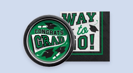 A black and green graduation themed plate and napkin.
