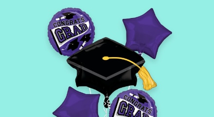 A bouquet of black and purple themed graduation balloons.