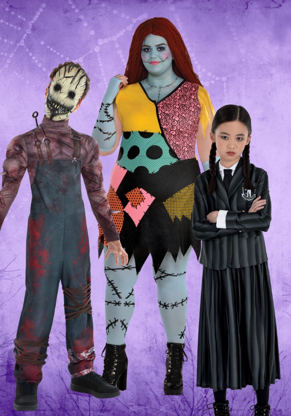 Three people dressed in various Halloween costumes.