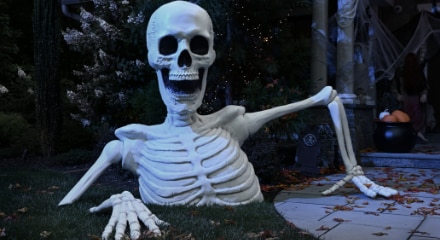 A skeleton breaking out of the ground decoration.