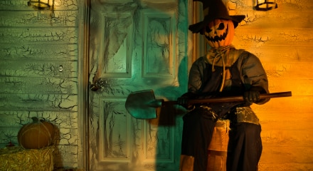 A scarecrow Jack-O'-Lantern animatronic decoration.