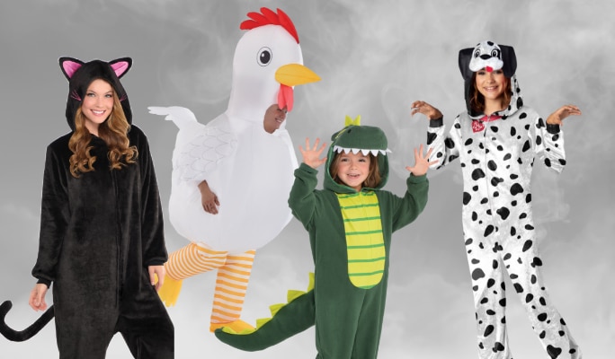 Two children, an adult and a toddler wearing assorted one-piece animal costumes. 