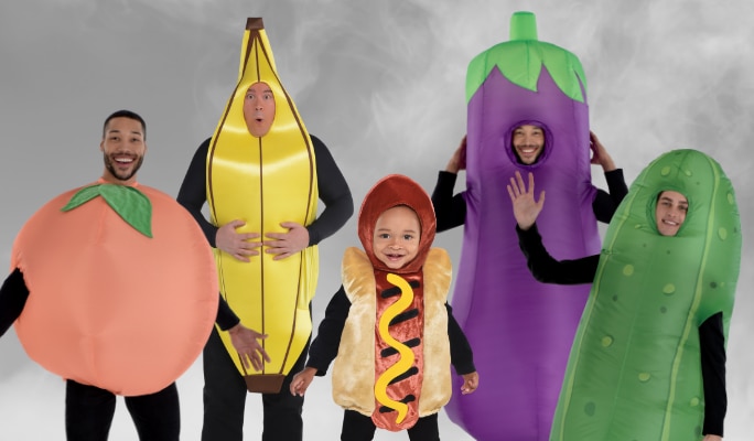 A group of adults and children wearing assorted food-themed costumes.