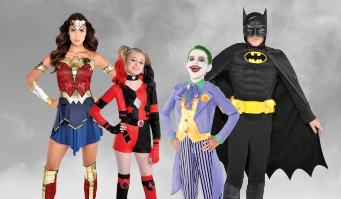 Four people dressed as the Joker, Batman, Wonder Woman and Harley Quinn.