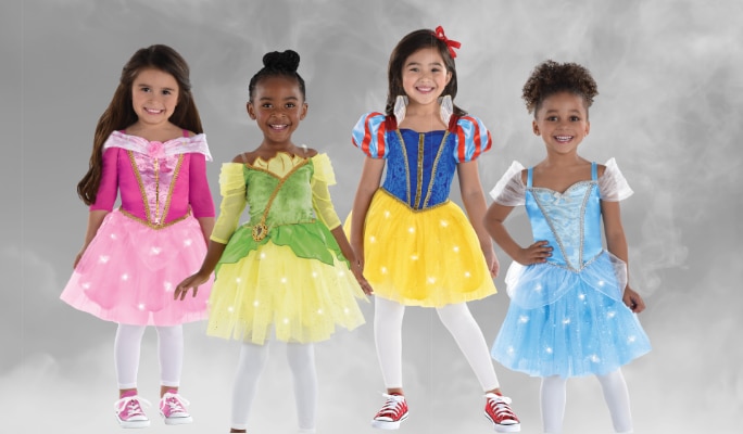 Four girls wearing assorted light-up Disney Princess character costumes.