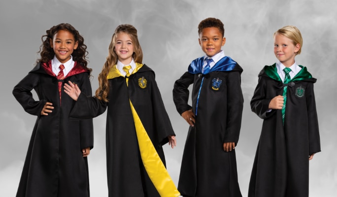 Four young people dressed in Harry Potter-themed robes.