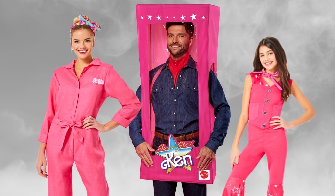 Three people dressed as Ken and Barbie.