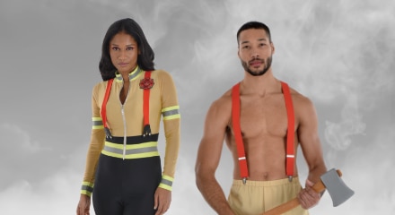 A woman and a man dressed as sexy firefighters.