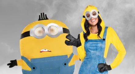 Two people wearing Minions costumes.